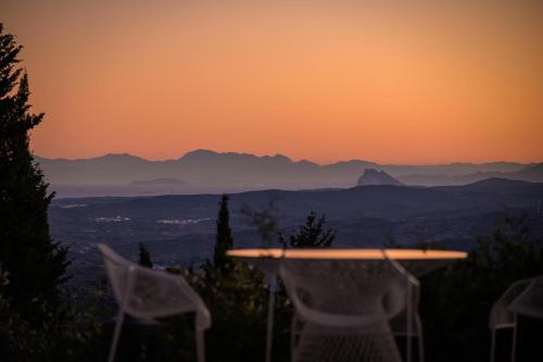 a view of the mountains at sunset from a house at Finca Olivar in Gaucín