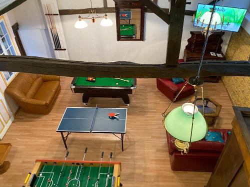 an overhead view of a living room with a pool table at Nogapatio - Maison d'Hôtes - BnB in Nogaro