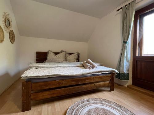a bedroom with a bed in a room with a window at Chalupa U Dvořáků in Lomnice nad Lužnicí
