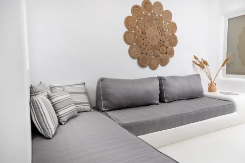 a couch in a living room with at Krina Mare Boutique Hotel in Naxos Chora