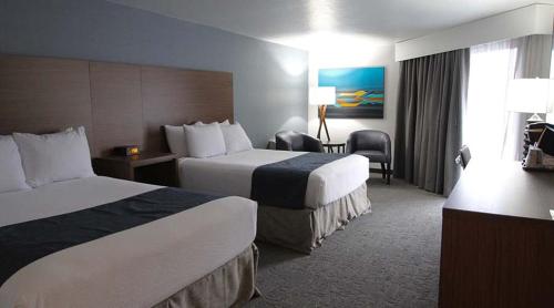 Ein Bett oder Betten in einem Zimmer der Unterkunft Hayward Inn