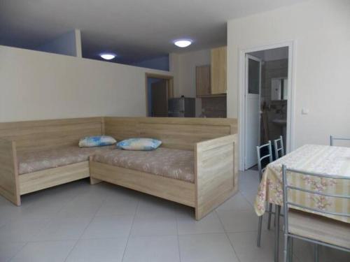 Postel nebo postele na pokoji v ubytování Vasili Apartments