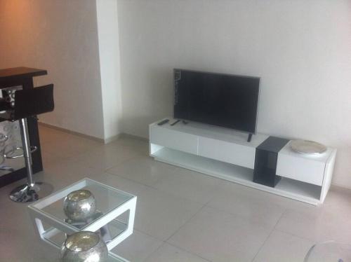 Amara Cancun Beachfront Condoにあるテレビまたはエンターテインメントセンター