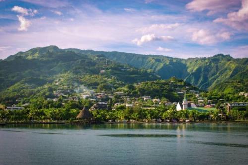 a town on the shore of a body of water at Naia Lodge - on the heights of the city in Arue