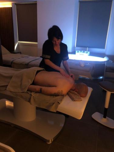a woman sitting on top of a mans leg at Hotel Du Lac & SPA in Bellagio