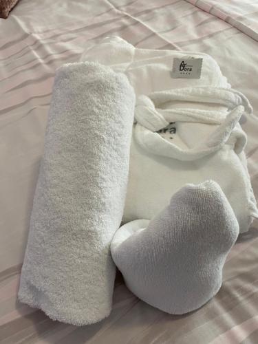 a pile of towels on top of a bed at Apartments Dora Sveti Martin na Muri in Sveti Martin na Muri