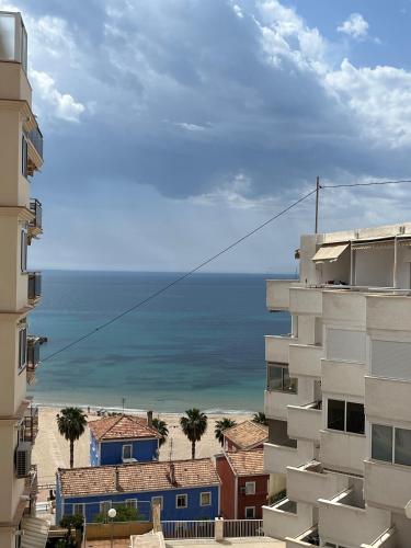 a view of the ocean from between buildings at Requena12 in Villajoyosa