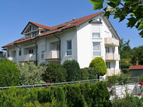 a large white building with a red roof at Am Bodensee-Radweg in Überlingen