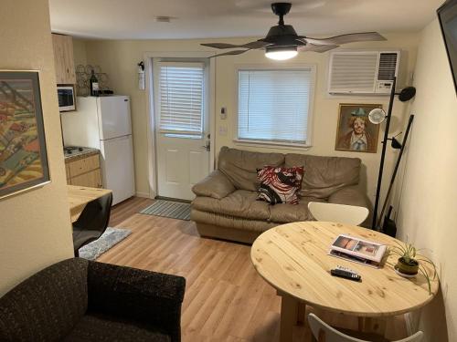a living room with a couch and a table at Loft , boat dock, 2 bedrooms , pet friendly in Gravois Mills