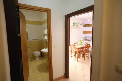 a kitchen and dining room with a table and chairs at PALAZZO PELLEGRINO vietri in Vietri sul Mare
