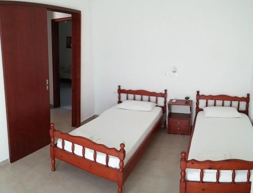 Postel nebo postele na pokoji v ubytování Dora Apartments