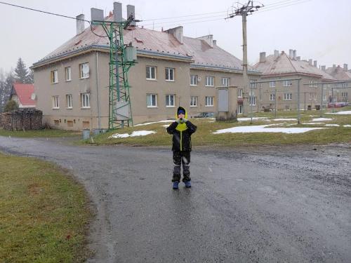 a young boy standing in the middle of a road at Marta P in Dětřichov nad Bystřicí
