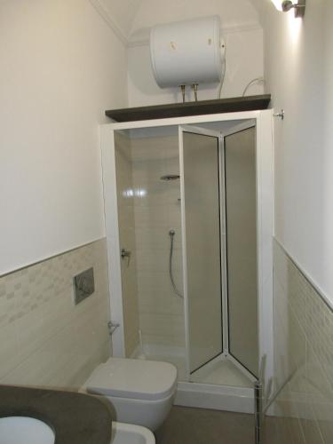 a bathroom with a shower and a toilet at Le Case Di Tufo- Casa del sole in Favignana