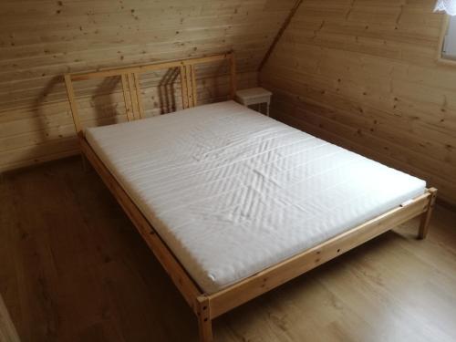 Säng eller sängar i ett rum på Domek letniskowy Ada, Gabrysia, Alan Wieleń