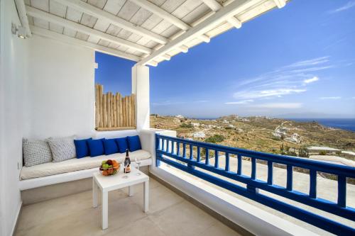 a balcony with a view of the ocean at Anius Apartments in Mýkonos City