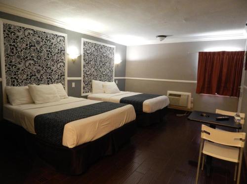 En eller flere senge i et værelse på Hotel Salina