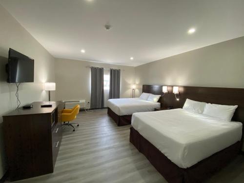 Ένα ή περισσότερα κρεβάτια σε δωμάτιο στο Econo Lodge