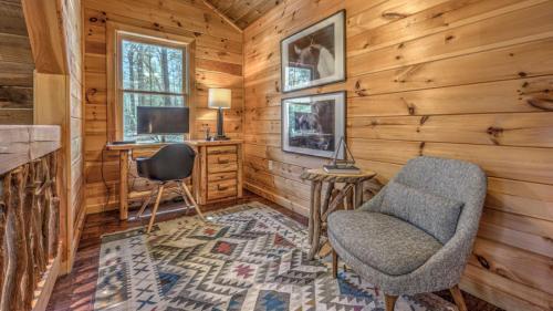 a room with a desk and chair in a log cabin at Aska Pines in Blue Ridge
