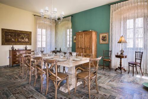 a dining room with a table and chairs at Luxury Villa Casa Maravillosa in Svoronata