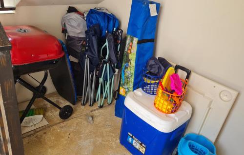 a corner of a room with a bunch of ski equipment at Colinas del Atlantico Vacational House 2nd Floor in Isabela