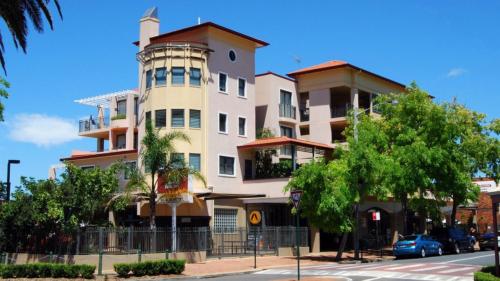 a large building on the corner of a street at Sea View - Ettalong Beach in Ettalong Beach