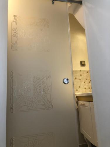a door with a design on it in a kitchen at Fancy Flats in Sibiu