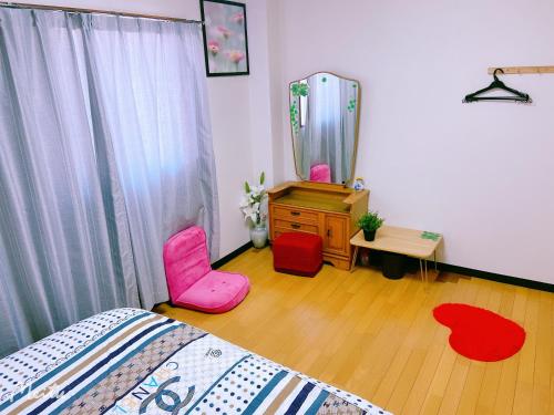 Katil atau katil-katil dalam bilik di Yoshidoku Inn Domemae 1 - Close to USJ World Expo Airport吉徳家庭旅館1ドーム前近万博USJ空庭菓匠温泉大阪城公园难波心斋桥関西空港直达免费寄存旅行箱