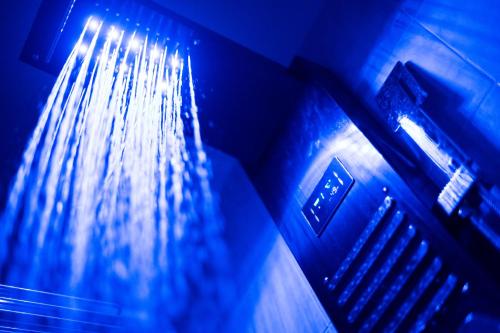 a close up of a water fountain with blue lights at B&B Villa Maracujà in Ionadi