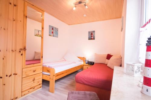 Haus-Karin-Ferienwohnung-3 tesisinde bir odada yatak veya yataklar