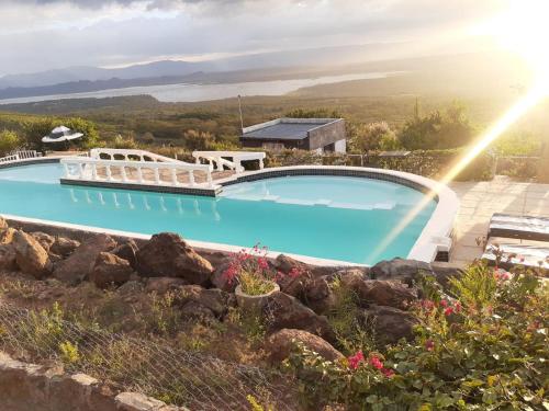 a swimming pool with a view of a mountain at Lemon Valley Farm in Elmenteita