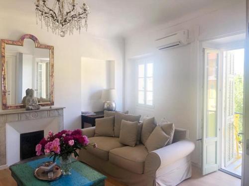 a living room with a couch and a mirror at Chez Kari-top location in charming old town in Nice