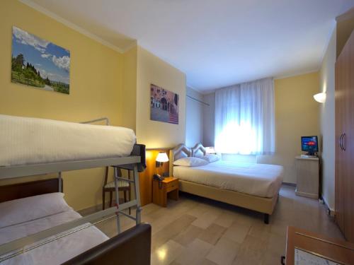 Postel nebo postele na pokoji v ubytování Veronello Resort