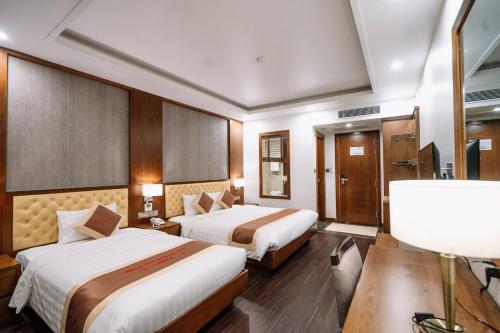 Ένα ή περισσότερα κρεβάτια σε δωμάτιο στο Lake Hills Hotel