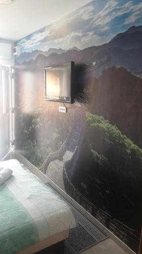 En eller flere senge i et værelse på SOBE ROOMS GAVRILO
