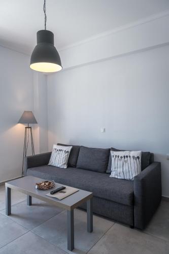 a living room with a couch and a coffee table at Milva Apartments in Kos Town