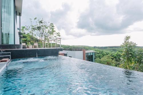 a swimming pool on the roof of a building at Sky View Luxury Pool Villa - SHA in Surat Thani