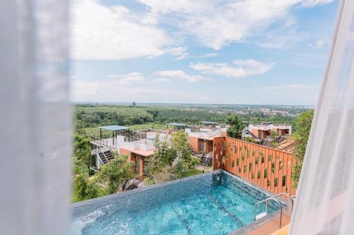 a view of a swimming pool from a house at Sky View Luxury Pool Villa - SHA in Surat Thani
