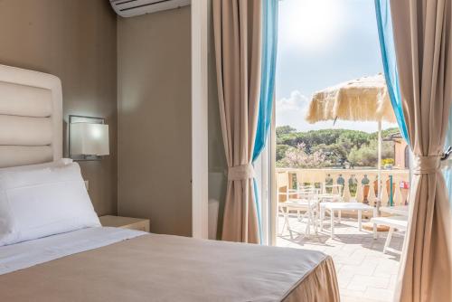 Кровать или кровати в номере Hotel Villa Bolgheri