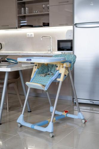 a kitchen counter with a sink and a table at Veria Panorama Luxury Suite With Garden. in Veria