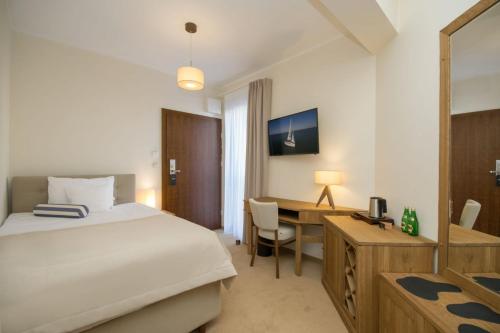 Postel nebo postele na pokoji v ubytování Hotel Szlak Bursztynowy