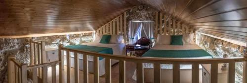 a small room with two beds in a house at Quinta Vale de Frades in Torrão