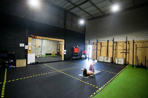 a person sitting on the floor of a gym at Hotel Colombo in Vila do Porto