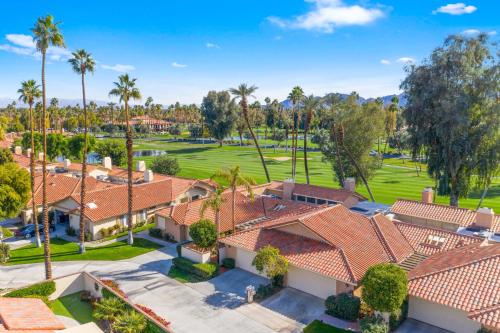 an aerial view of a golf course with palm trees and houses at Spectacular condo with private golf privileges includes golf cart on Monterey Country Club !! in Palm Desert