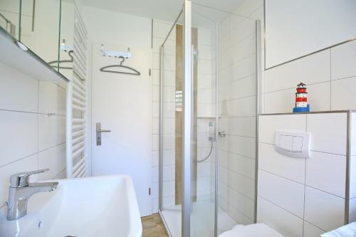 a bathroom with a shower and a sink at Urlauberdorf Haus 63d in Boltenhagen