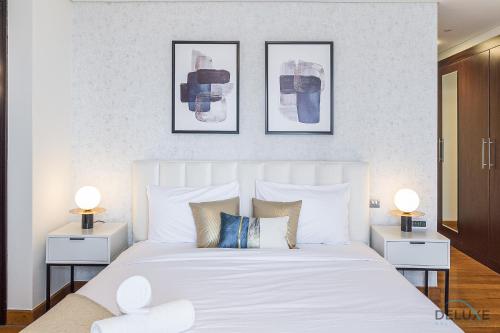 Postel nebo postele na pokoji v ubytování Refreshing 1BR Loft At Sky Garden DIFC By Deluxe Holiday Homes