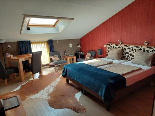 Un pat sau paturi într-o cameră la Boerderij Hazenveld