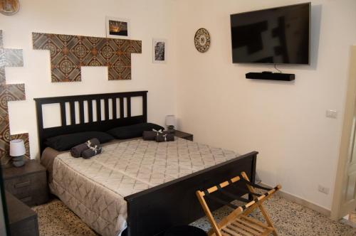 Een bed of bedden in een kamer bij SAN GIACOMO APARTMENT