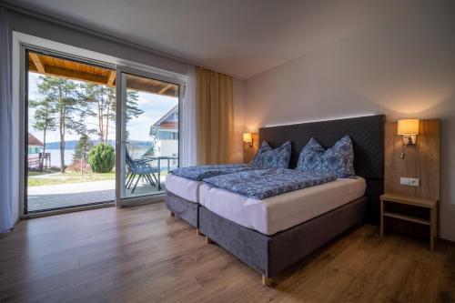 מיטה או מיטות בחדר ב-Apartment Riviera 511-3 Lipno Home