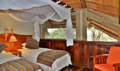 Кровать или кровати в номере Lokuthula Lodge