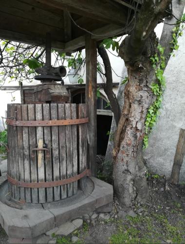 a wooden fence next to a tree next to a building at Marlingsuites - Vinea - Wieser Josef - Marling in Marlengo